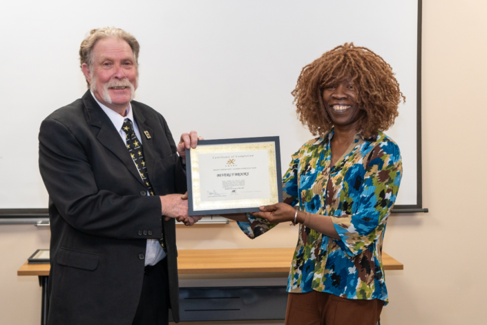 Beverly Brooks - Receives Graduation Certificate