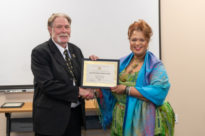 Judith Francis - Receives Graduation Certificate