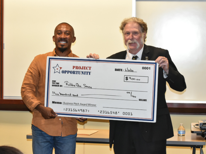 First Place Business Pitch Award Check Presentation to Robert L. Lambert, Jr.